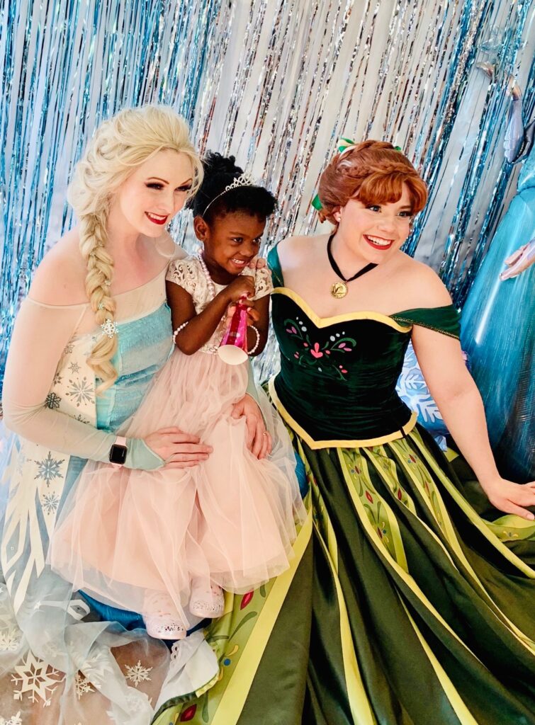 Two ladies dressed as Elsa and Anna