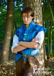 A man in a polo shirt, vest, and waist belt