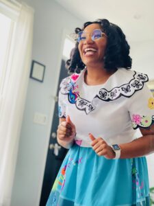 A girl in a blue and white dress